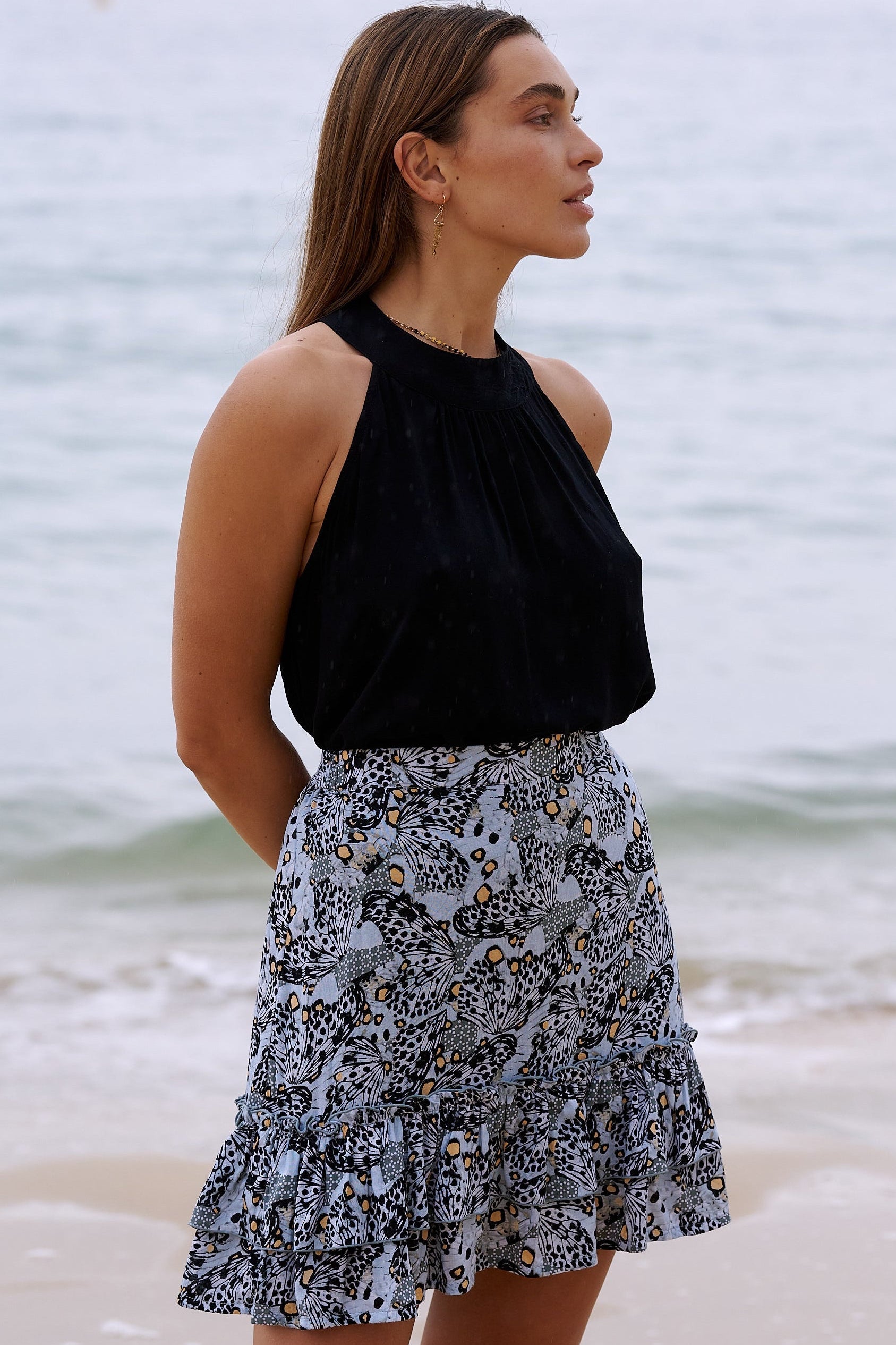 Harla mini ruffle skirt cool grey and coral butterfly print