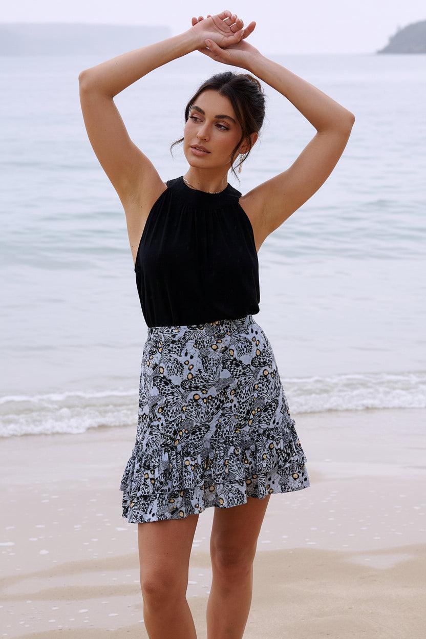 Harla mini ruffle skirt cool grey and coral butterfly print