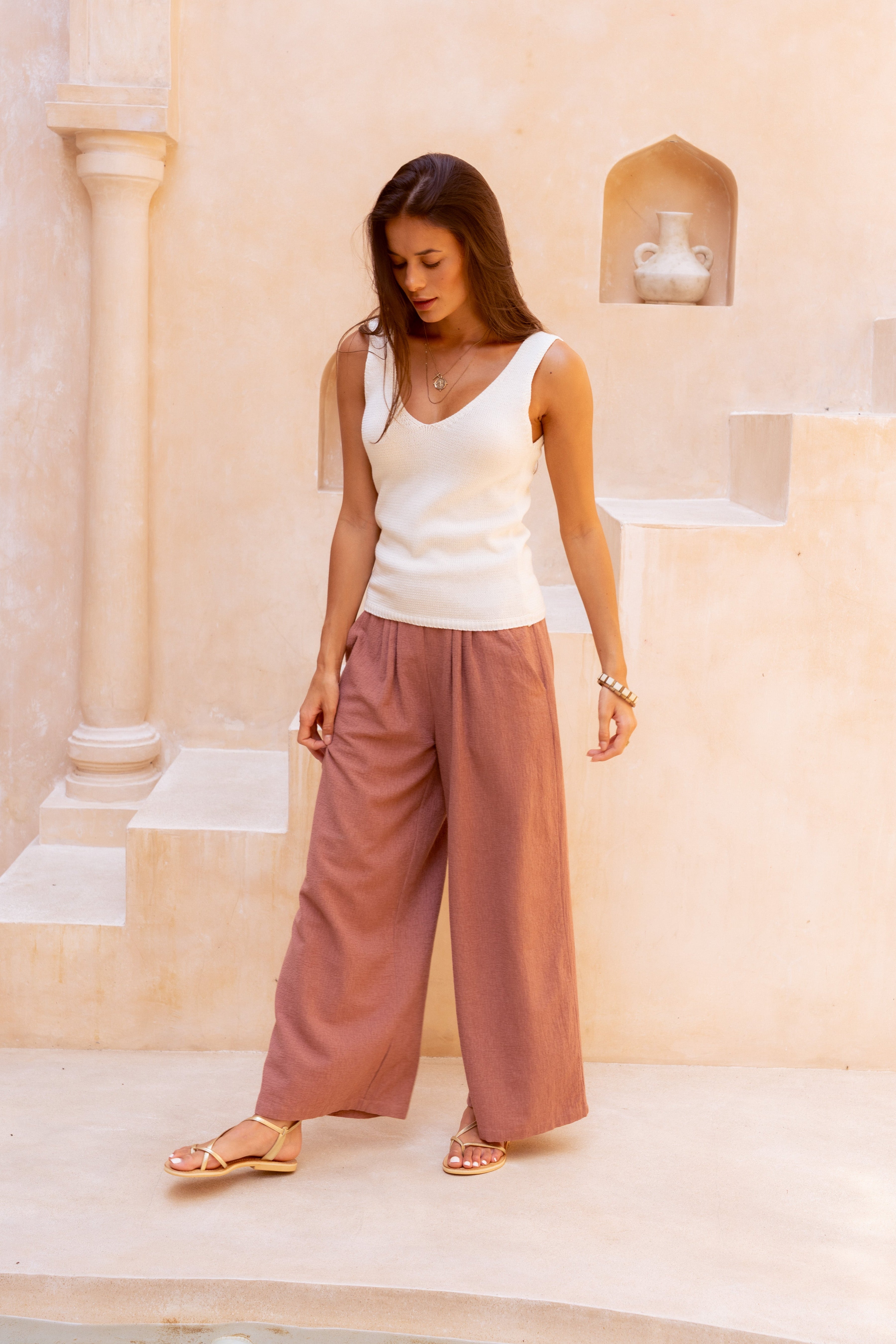 Harla cotton and linen trousers in rustic pink with creme 100% cotton knit tank top and gladiator style gold sandals