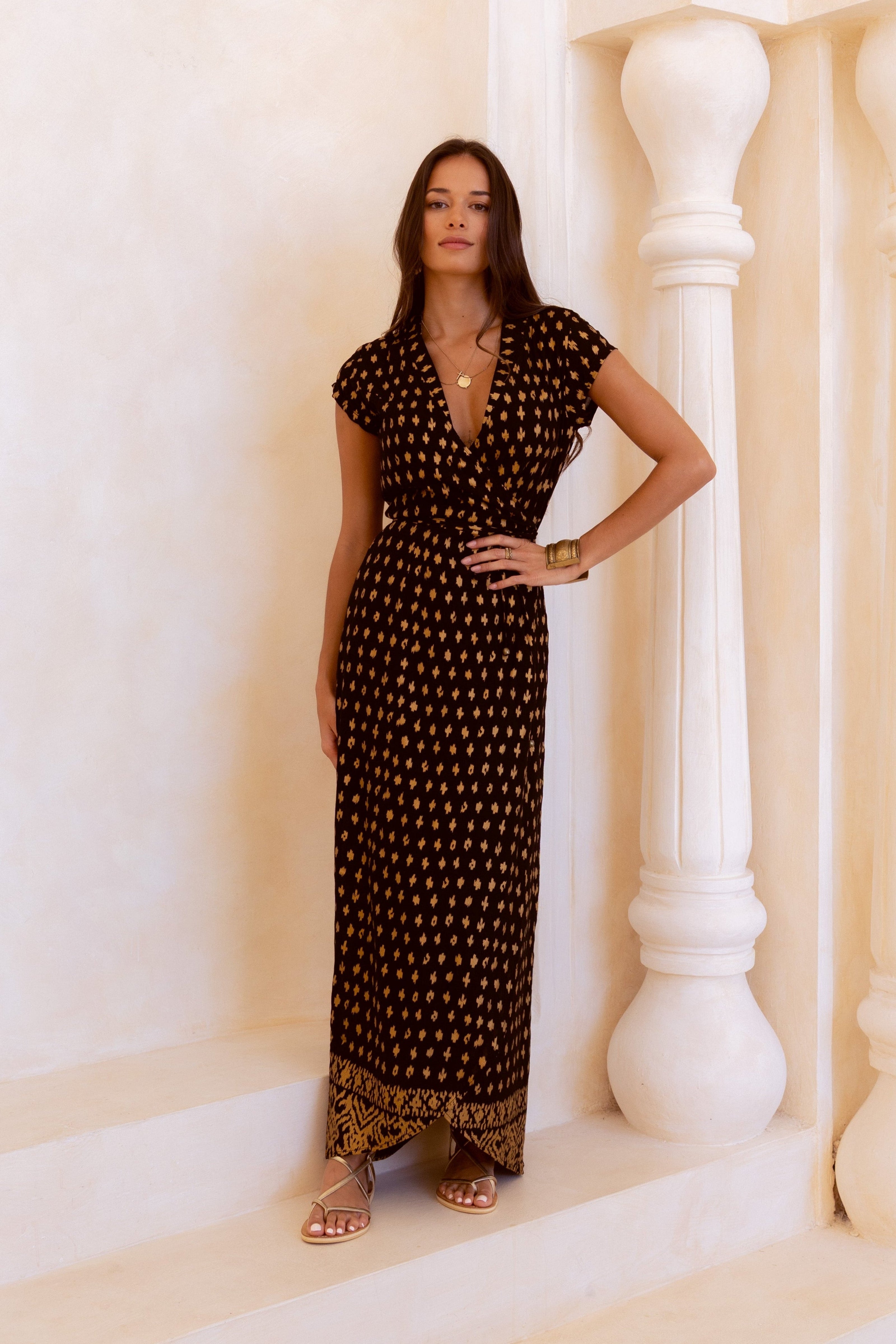 Black and shimmering gold maxi wrap dress