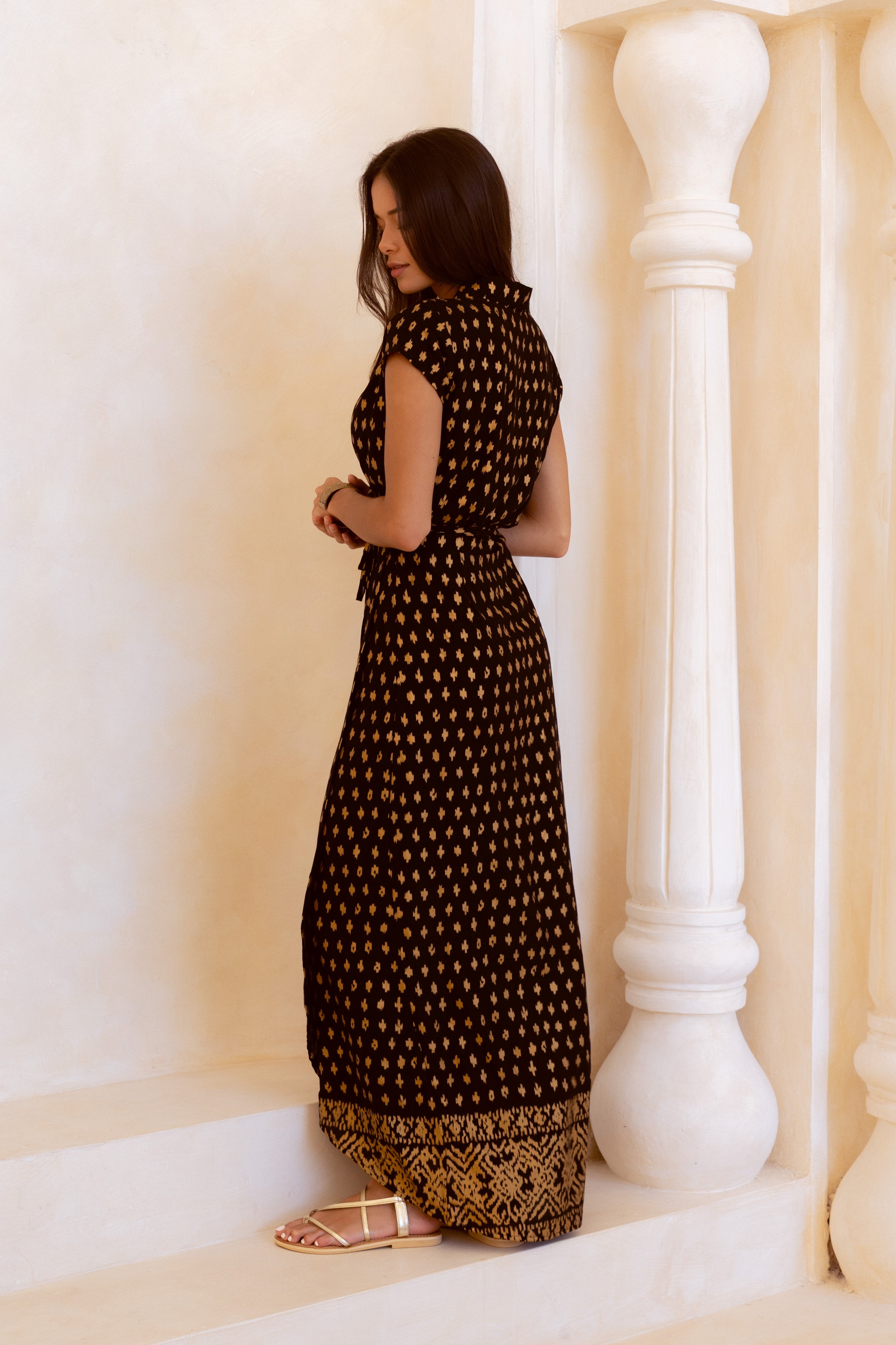 Black and shimmering gold maxi wrap dress