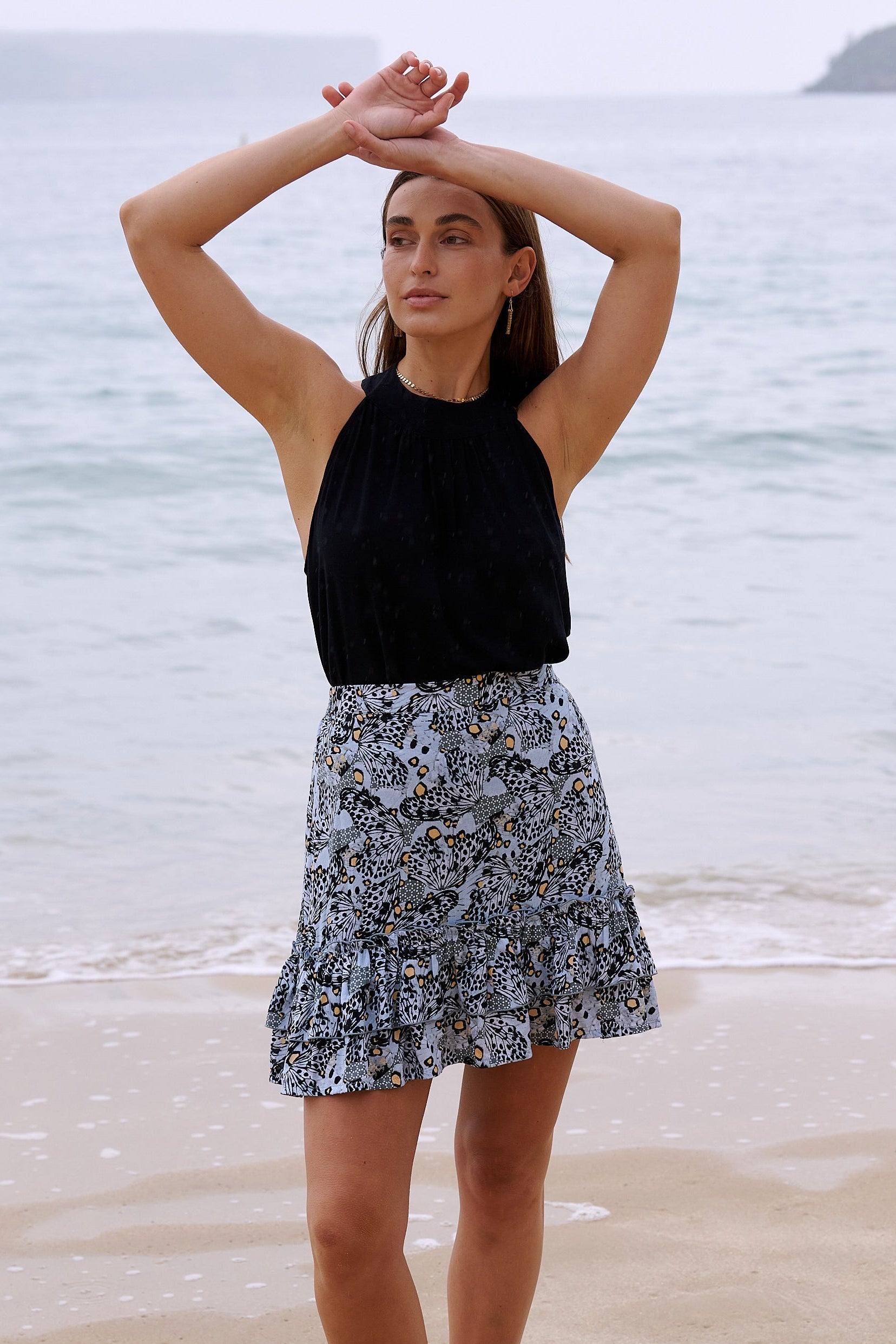 Harla mini ruffle skirt cool grey and coral butterfly print