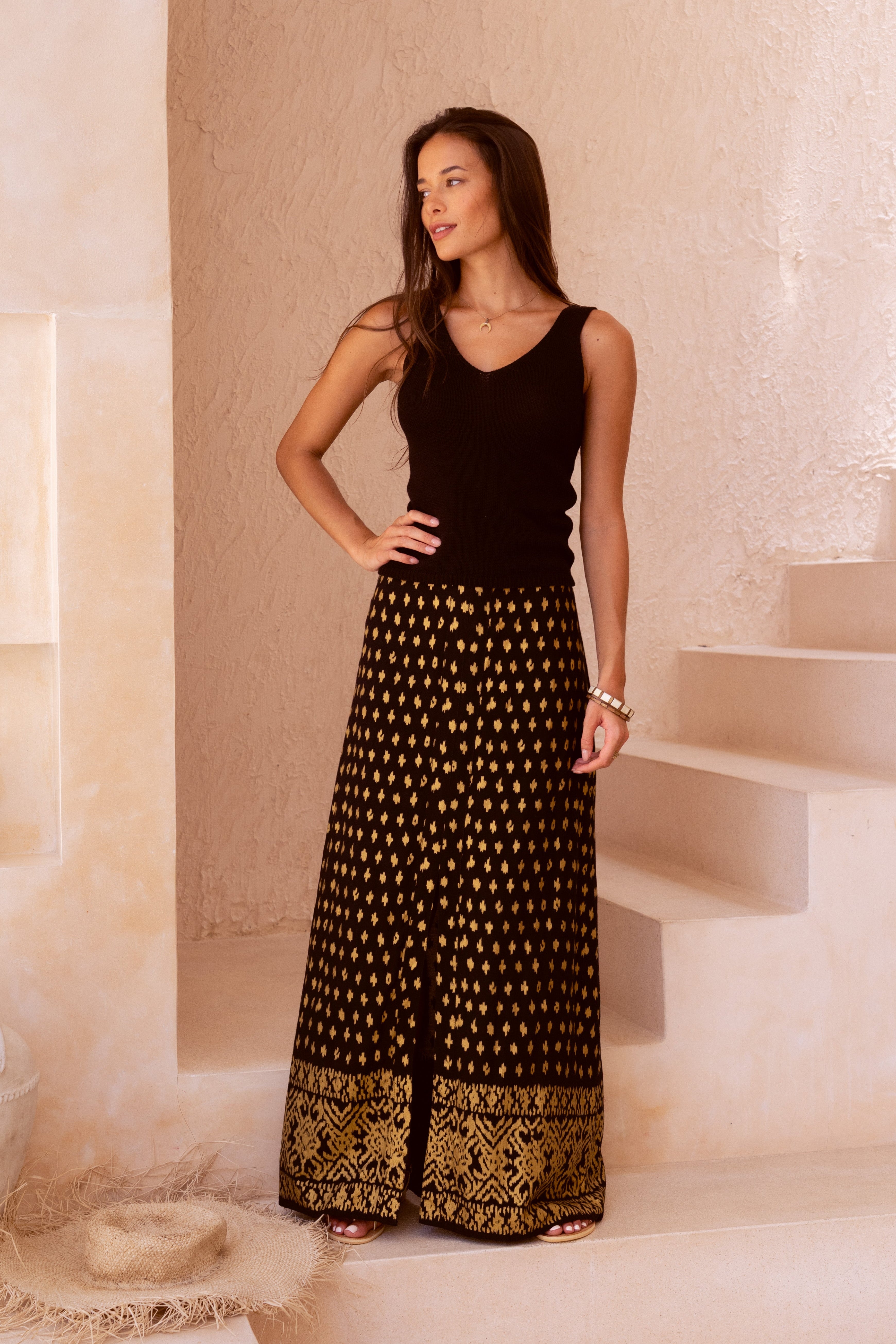 Harla black and gold maxi skirt with black 100% cotton knit tank top with gladiator style sandals in shimmering gold