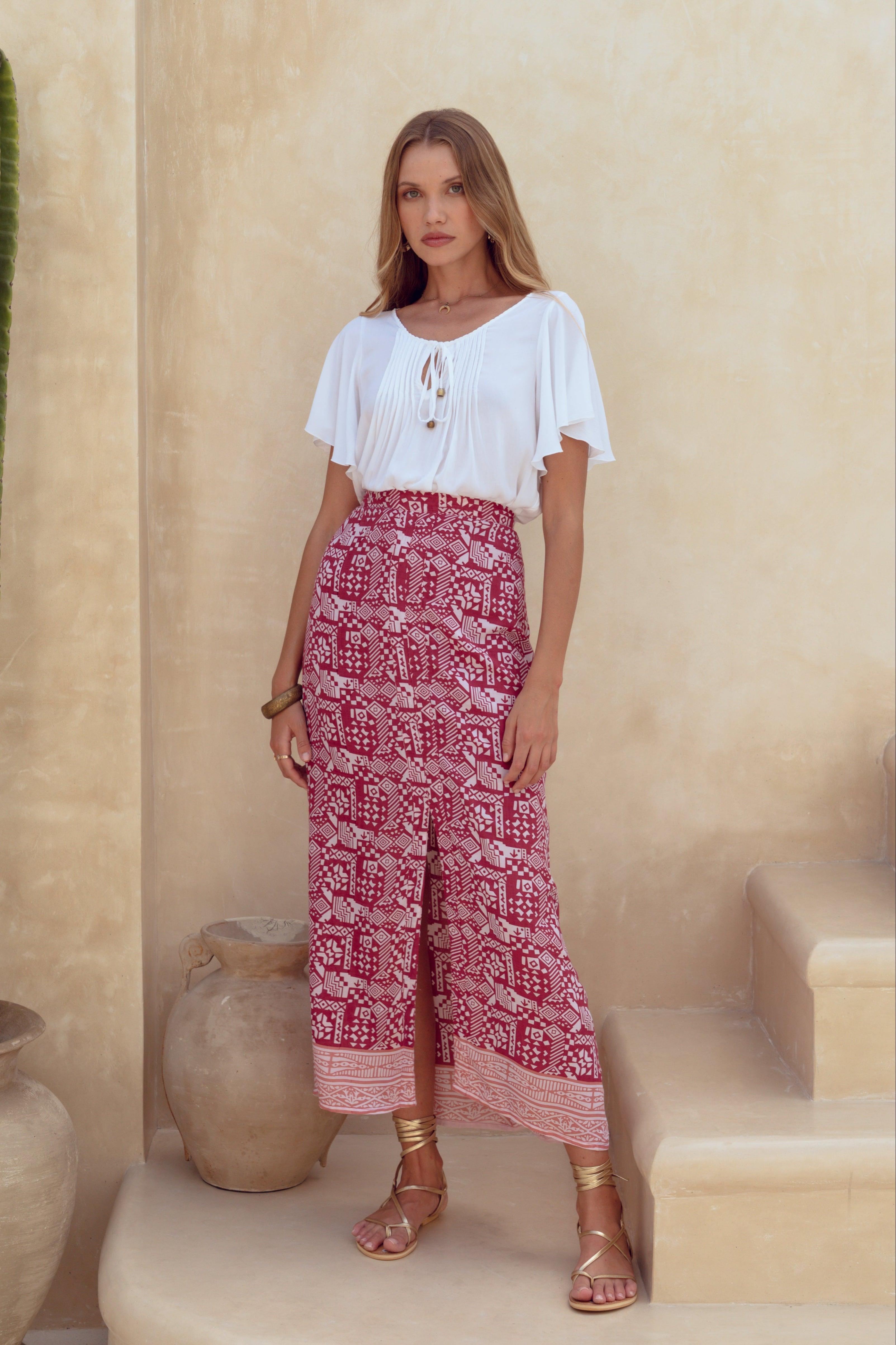 Harla white bell sleeve blouse and dusty rose print maxi skirt