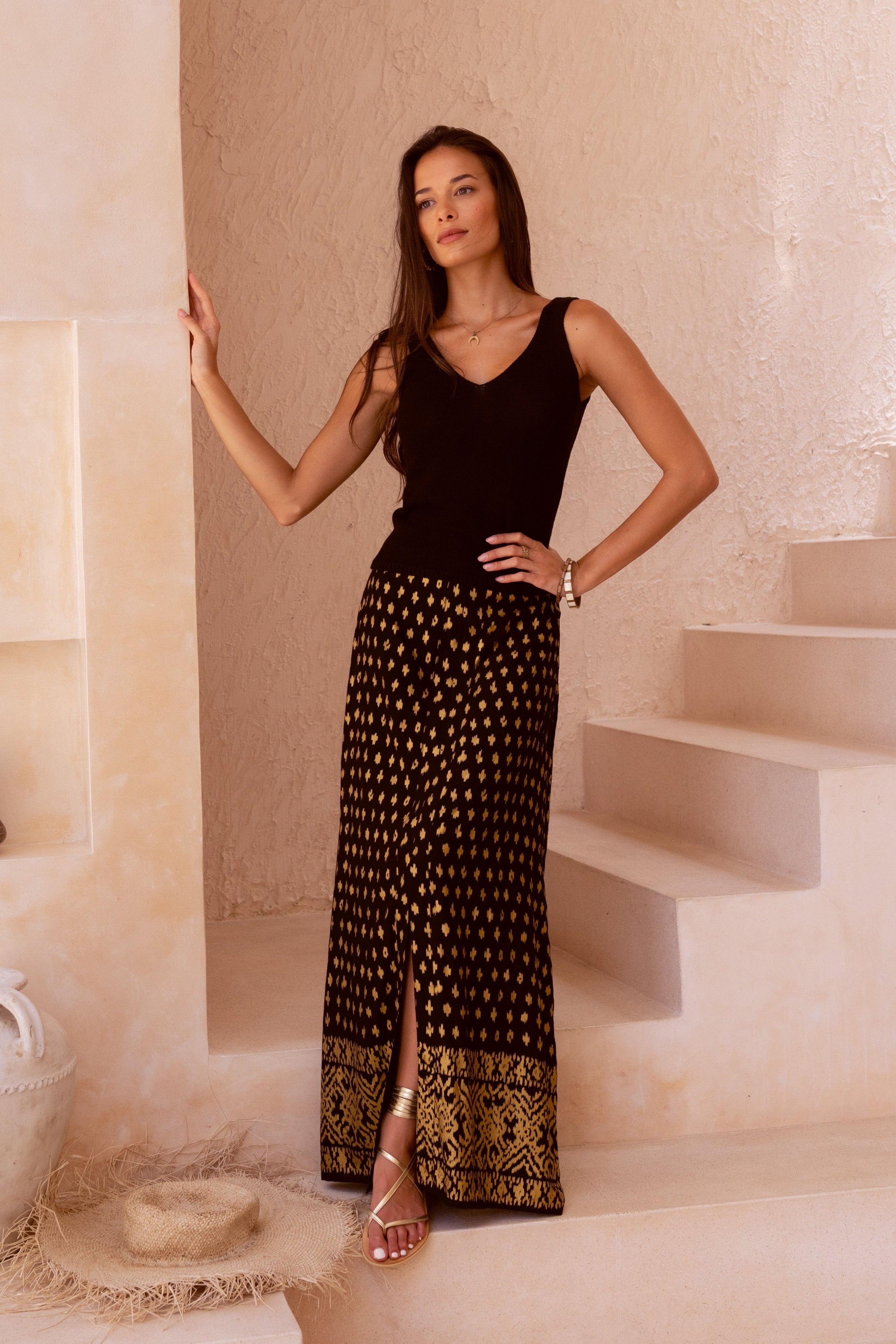 Harla black and gold maxi skirt with black 100% cotton knit tank top with gladiator style sandals in shimmering gold