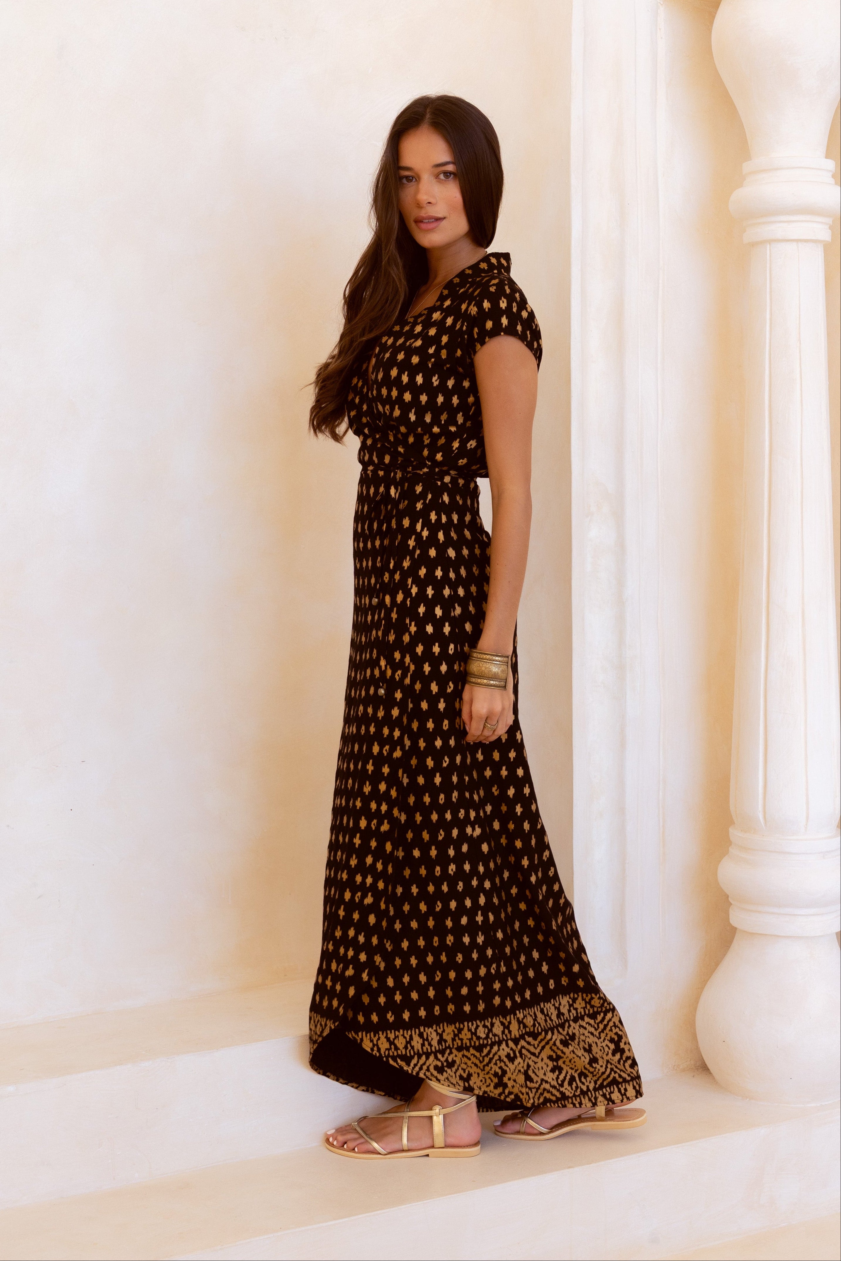 Black and shimmering gold maxi wrap dress