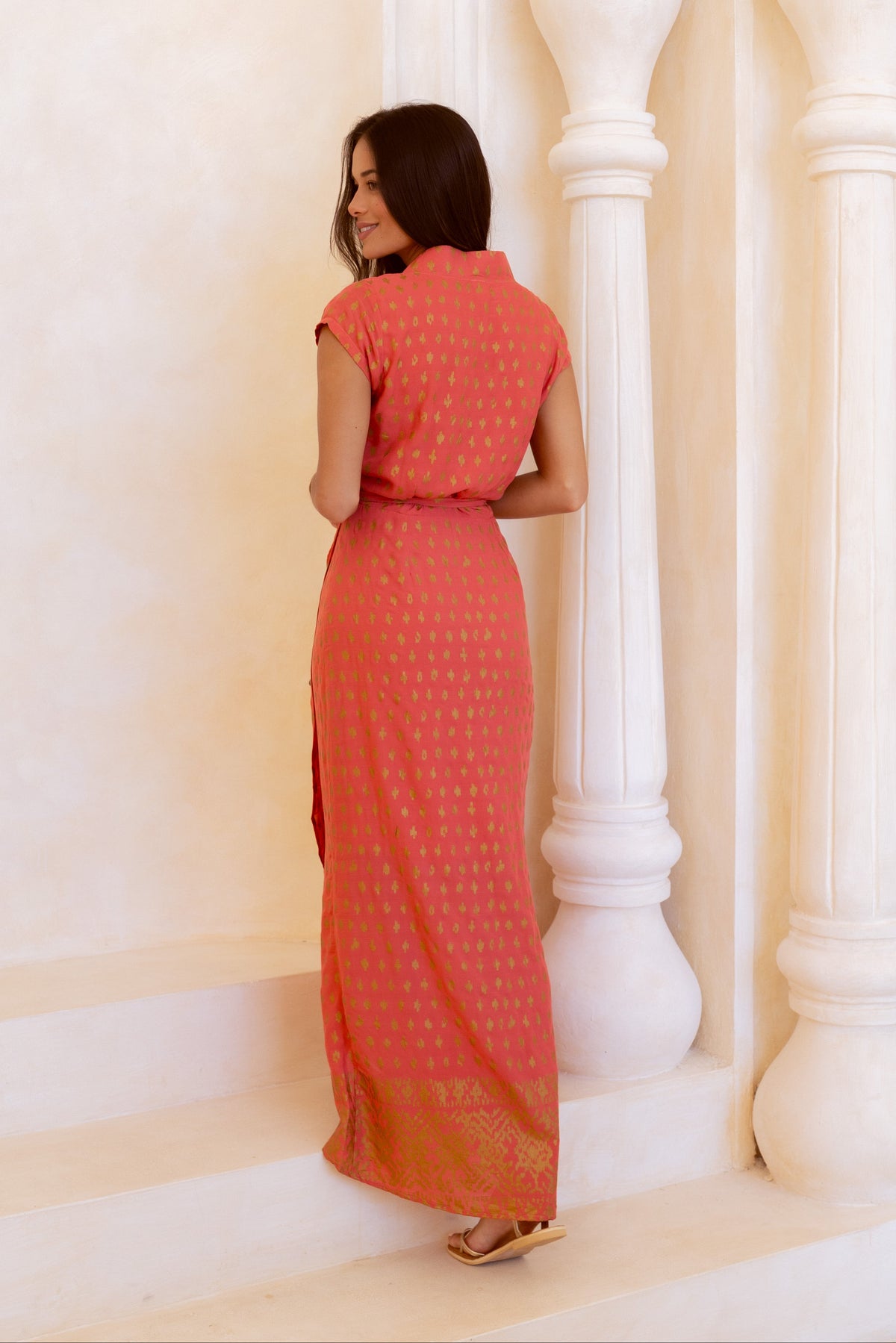 Vivid coral and shimmering gold wrap dress